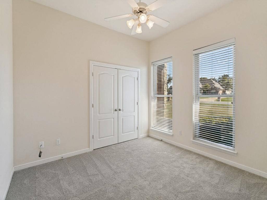 508 Singing Quail Trail, Haslet, TX 76052 Recessed ceiling, neutral wall paint, two windows with blinds, gray carpet, and a ceiling fan