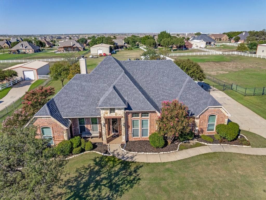 508 Singing Quail Trail, Haslet, TX 76052 Brick and stone exterior with a gray shingle roof