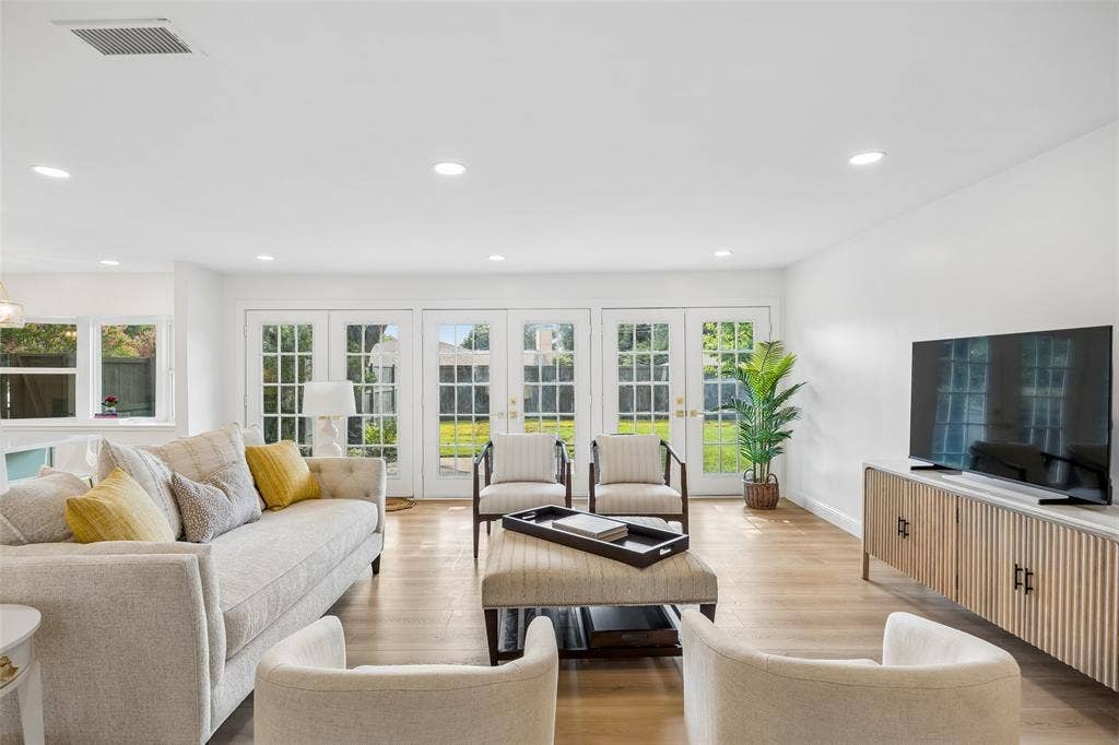 11864 Cold Harbor Lane, Dallas, TX 75244 Spacious living area with french doors leading to the private backyard.
