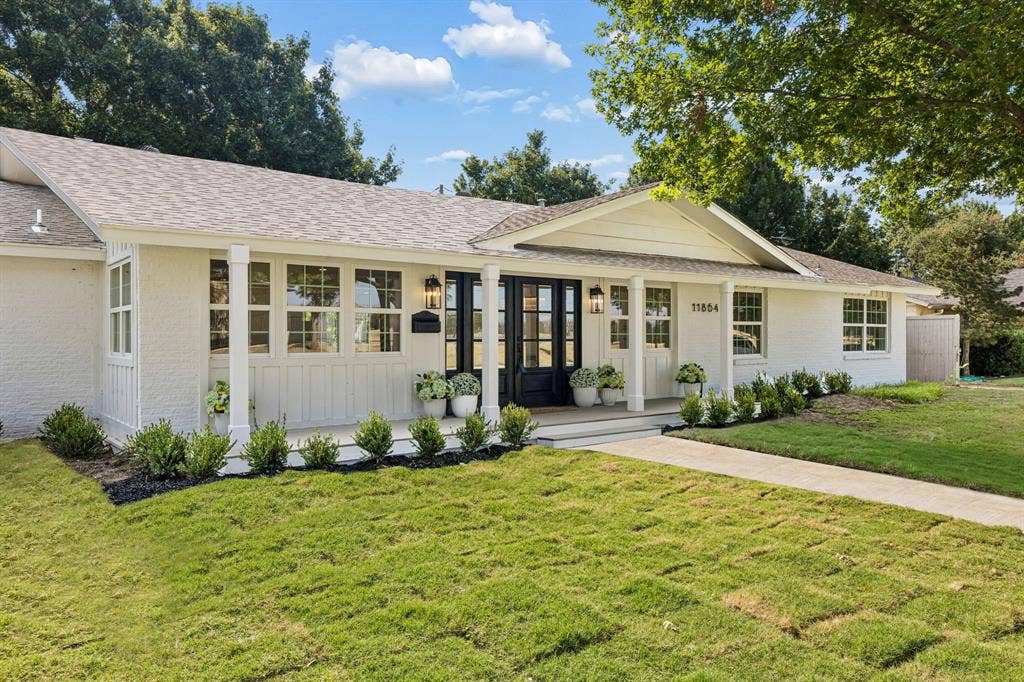 11864 Cold Harbor Lane, Dallas, TX 75244 Beautifully updated single-story home with a welcoming covered front porch, striking double front doors, mature trees and thoughtfully designed landscaping.