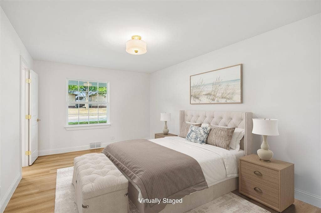 11864 Cold Harbor Lane, Dallas, TX 75244 Bedroom connected to a Jack and Jill bath with LVT floors and a large window bringing lots of natural light.