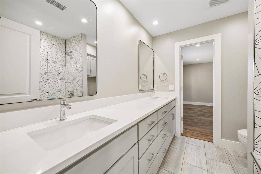 Jack and Jill, Dual-sink vanity with designer shower tile