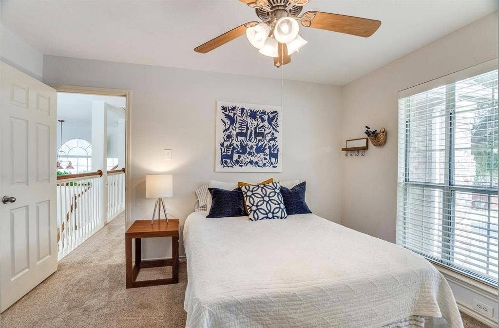 1944 Vantage Drive, Plano, TX 75075 Bedroom featuring a ceiling fan with light fixture, neutral carpeting, and a window with blinds