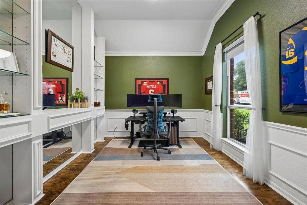3104 Congress Avenue, Plano, TX 75025 Built-in shelving with glass inserts, dedicated desk area, wood-finish flooring, accent wall, and crown molding