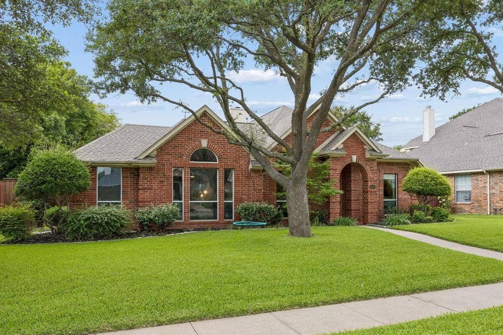 3104 Congress Avenue, Plano, TX 75025 Brick exterior with arched entry and transom window