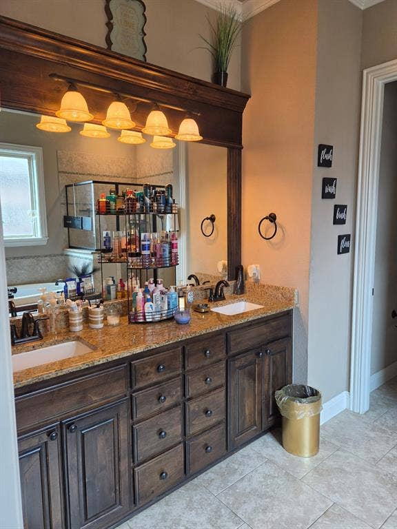 2313 Therese, Waco, TX 76712 Dual vanity with dark wood cabinetry and granite countertops