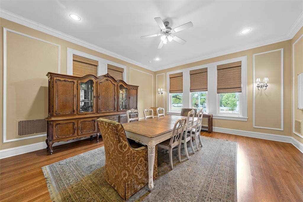 2424 Austin Avenue, Waco, TX 76701 Hardwood flooring, crown molding, decorative wall trim, recessed lighting, and a ceiling fan with light fixture