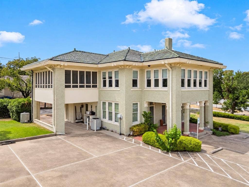 2424 Austin Avenue, Waco, TX 76701 Two-story building with a covered entry, screened porch, and ample paved parking