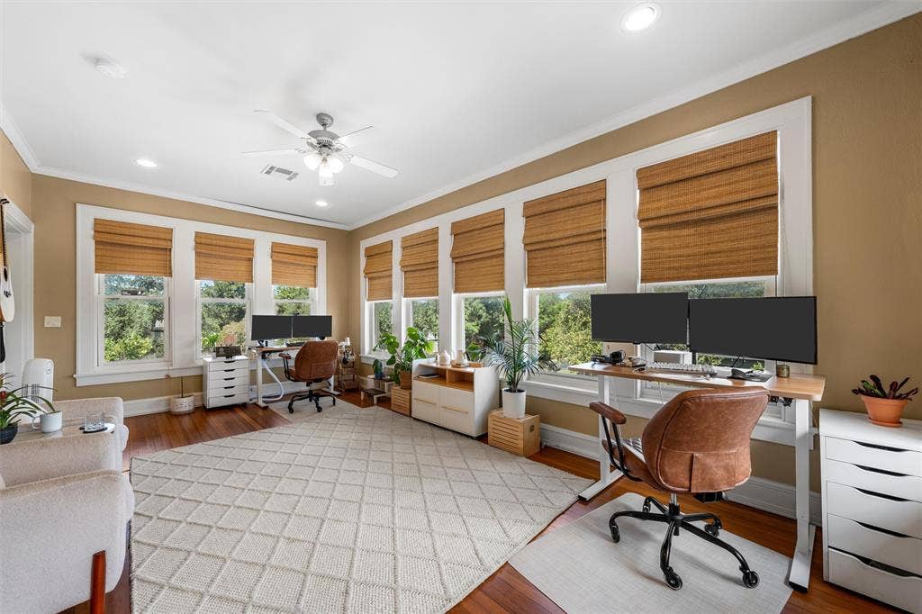 2424 Austin Avenue, Waco, TX 76701 Hardwood flooring, recessed lighting, ceiling fan, multiple windows with blinds, and neutral wall tones