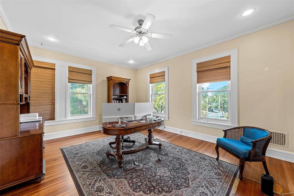 2424 Austin Avenue, Waco, TX 76701 Hardwood flooring paired with crown molding, recessed lighting, and a ceiling fan