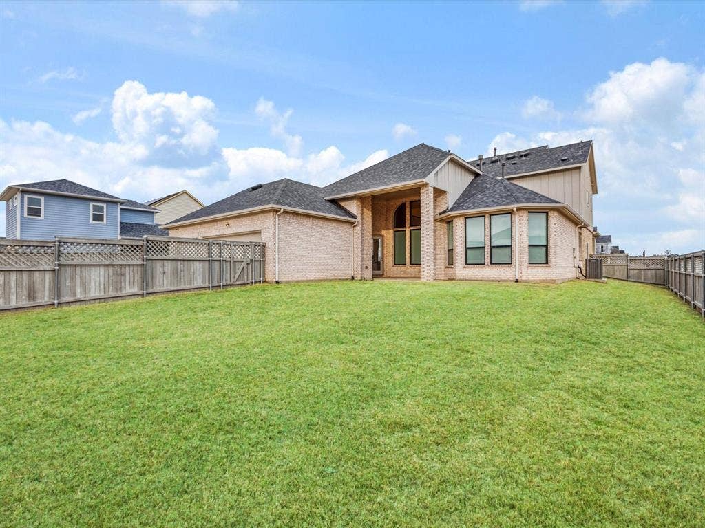 508 N Pecan Parkway, Northlake, TX 76247 Expansive backyard with manicured lawn, full privacy fencing, and a brick exterior