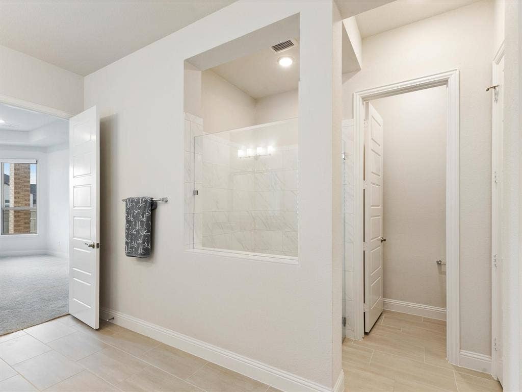 508 N Pecan Parkway, Northlake, TX 76247 Shower with glass enclosure and light-toned tile surround, recessed lighting, and a separate water closet