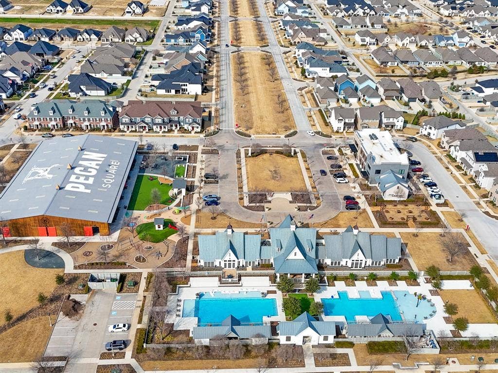 508 N Pecan Parkway, Northlake, TX 76247 Community featuring multiple swimming pools, extensive green spaces, dedicated parking areas, and a large recreational building