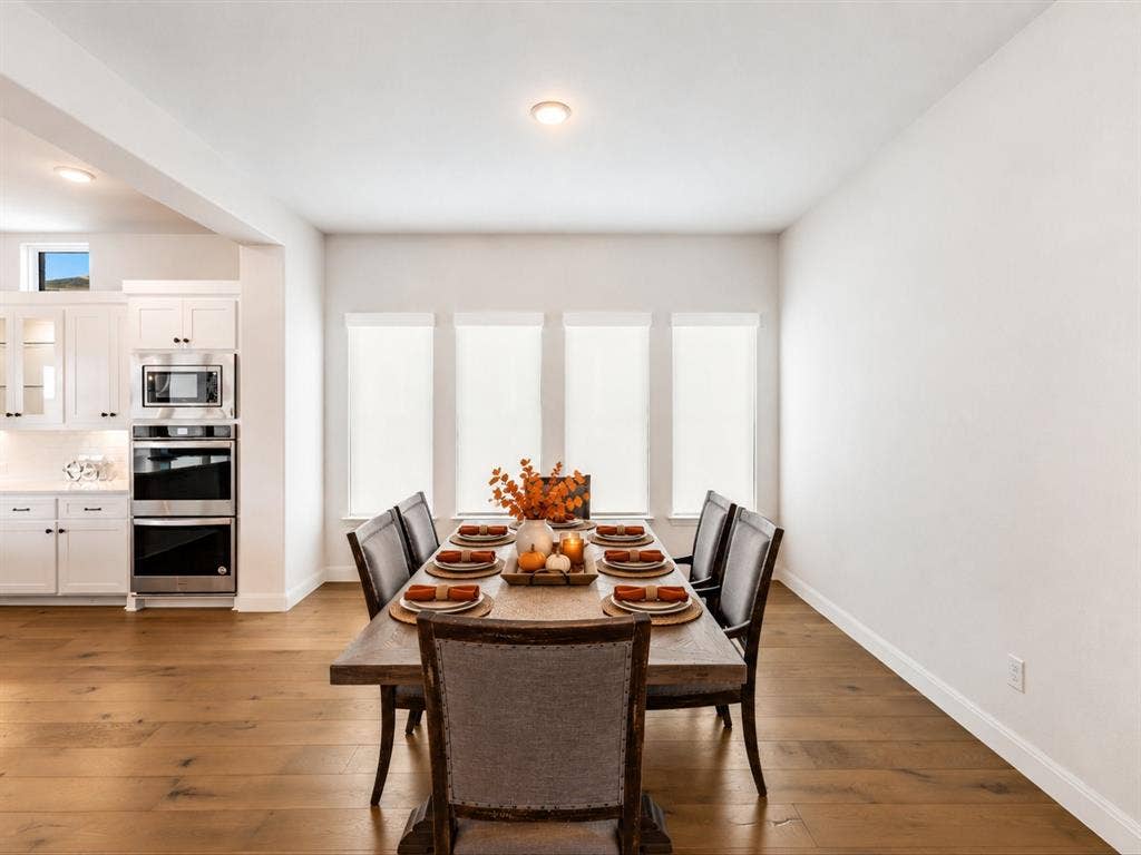 508 N Pecan Parkway, Northlake, TX 76247 Hardwood-style flooring extends through the dining area, featuring a recessed ceiling light