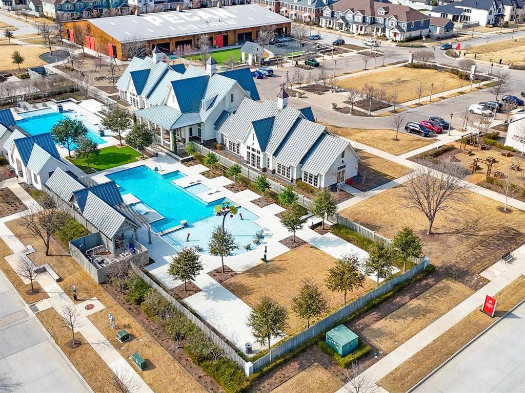 508 N Pecan Parkway, Northlake, TX 76247 Community amenity center featuring multiple pools, a water play area, and extensive hardscaping