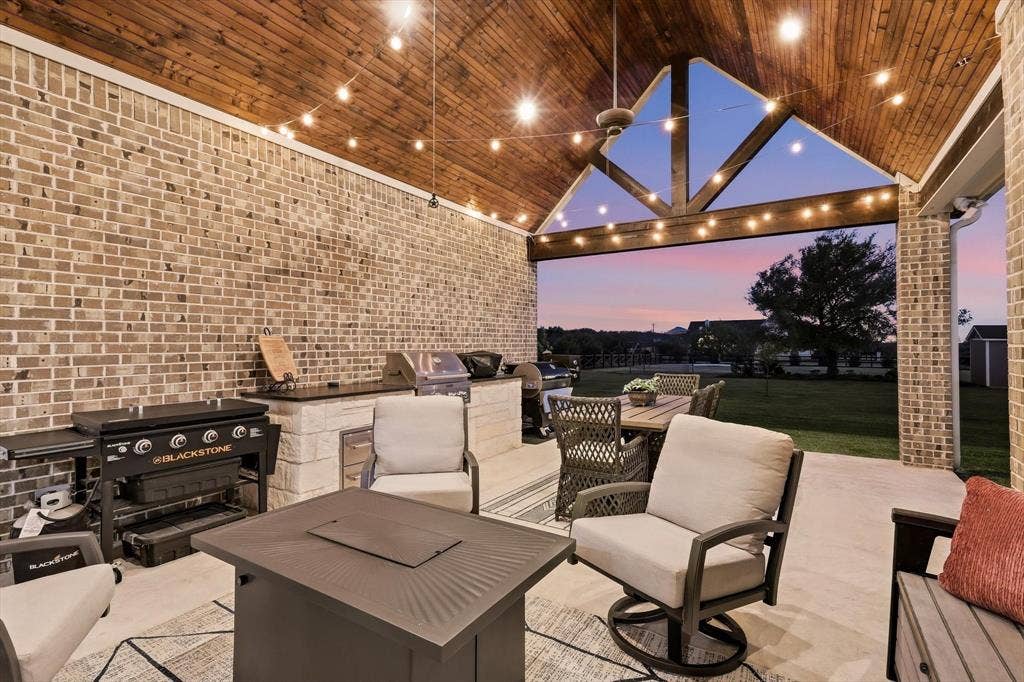 3424 Stardust Lane, Northlake, TX 76226 Large covered patio with tongue and groove pine cathedral ceiling has built-in grill, storage, ice chest