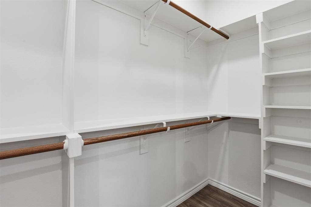 5718 Barkridge Drive, Granbury, TX 76048 Large Primary closet with storage built in.