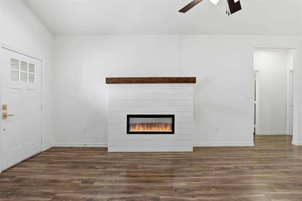5718 Barkridge Drive, Granbury, TX 76048 Electric Fireplace that pushes heat and different color flames