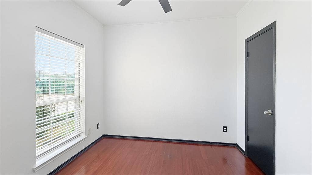 1700 Amelia Court, #126, Plano, TX 75075 Wood-finish flooring, white walls, white window blinds, dark trim door, ceiling fan
