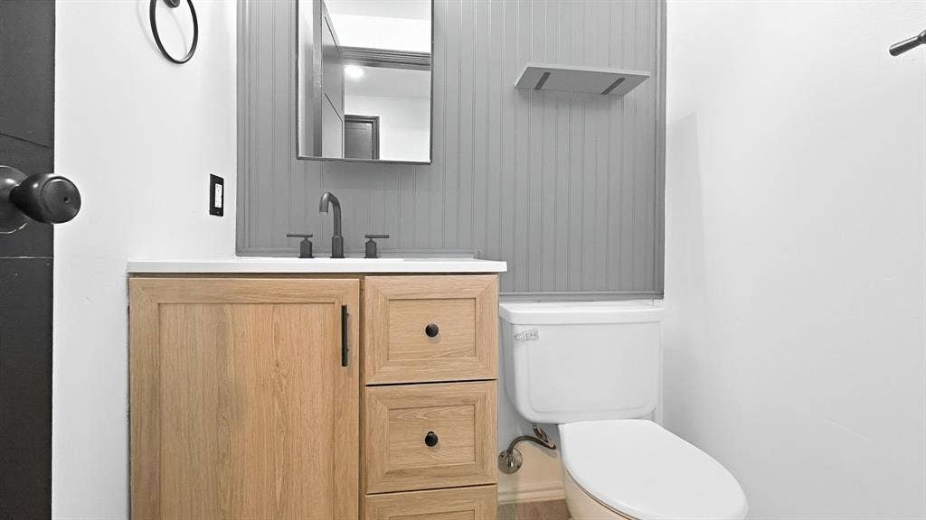 1700 Amelia Court, #126, Plano, TX 75075 Vanity with a light wood-finish cabinet and white countertop