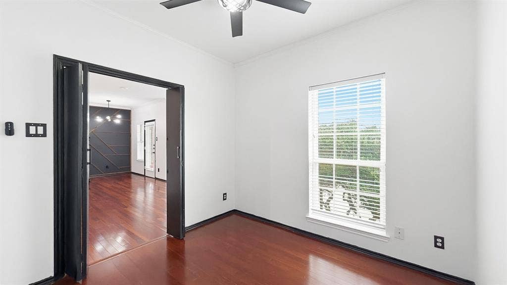 1700 Amelia Court, #126, Plano, TX 75075 Hardwood flooring throughout, white walls, black trim, ceiling fan with integrated lighting, and a window with blinds
