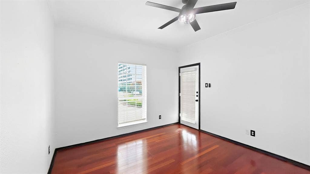 1700 Amelia Court, #126, Plano, TX 75075 Hardwood flooring, a ceiling fan with integrated lighting, a window with blinds, and a door with an integrated blind