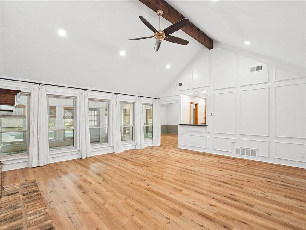 1304 Carriage Creek Drive, DeSoto, TX 75115 Vaulted ceiling with exposed wood beam, recessed lighting, and a ceiling fan