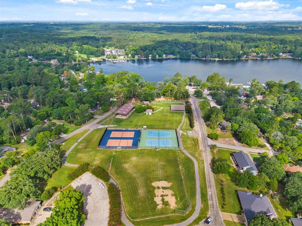 1656 Pineview Lane, Hideaway, TX 75771 Expansive waterfront property featuring mature trees and established roads