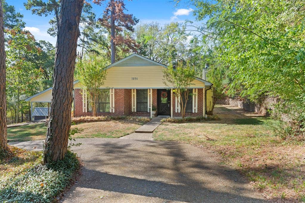 1656 Pineview Lane, Hideaway, TX 75771 Brick and siding exterior with mature trees