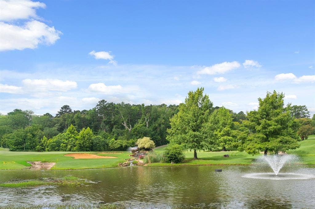 1656 Pineview Lane, Hideaway, TX 75771 Water feature with fountain and surrounding trees