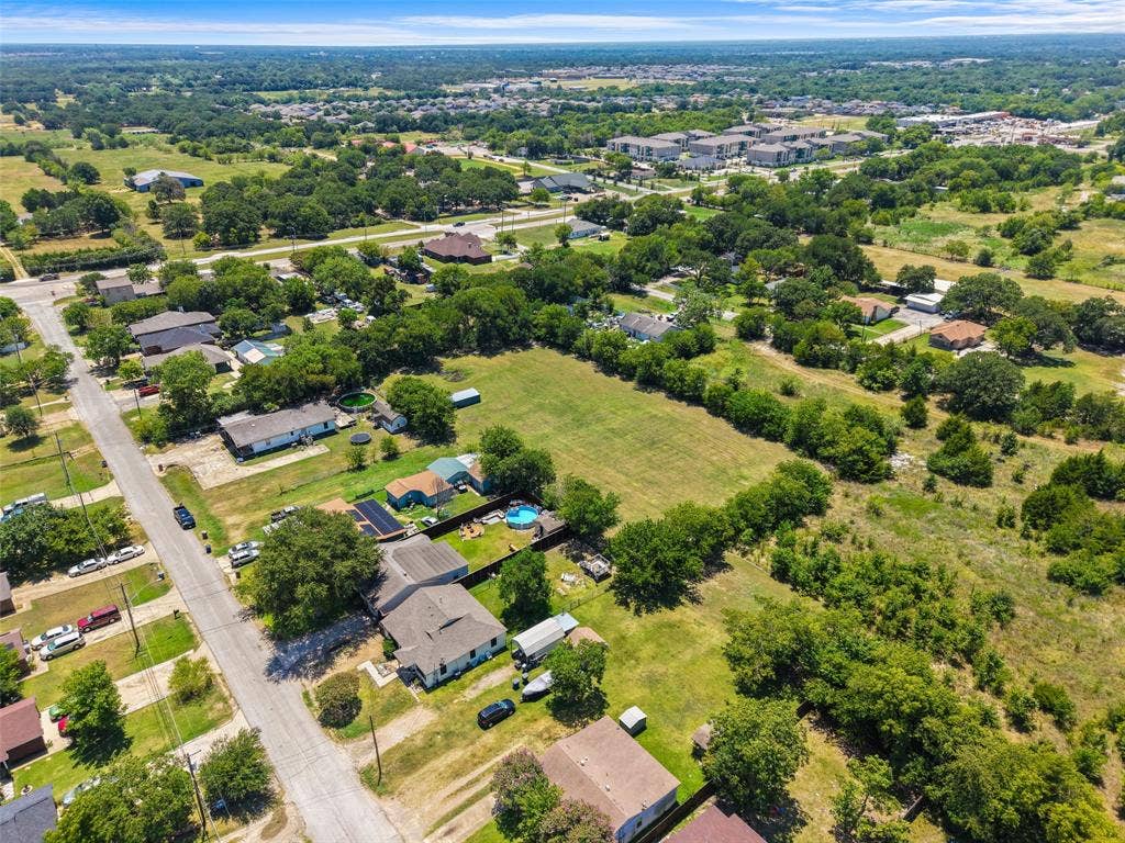 74 Sarah Lane, Dallas, TX 75253 Aerial perspective showcasing expansive green spaces, residential properties, and surrounding tree coverage