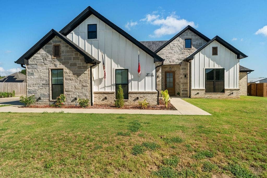 16139 Eagle Lane, Lindale, TX 75771 Stone and vertical white siding exterior with dark trim