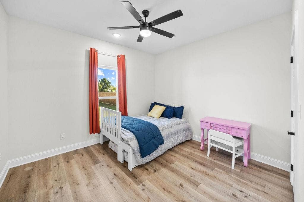 16139 Eagle Lane, Lindale, TX 75771 Recessed lighting, wood-finish flooring, ceiling fan, white trim, and a window