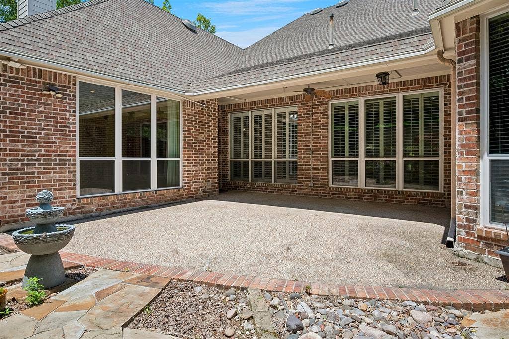 8141 Rosemont Drive, Plano, TX 75025 Incredible patio with ceiling fans, custom stone work, fountain.