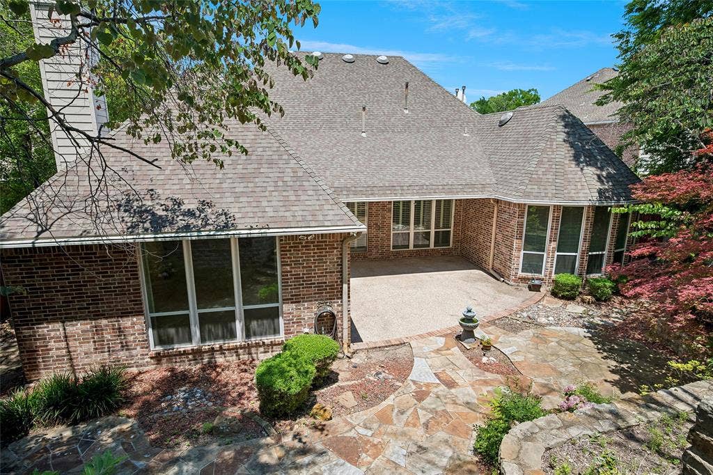 8141 Rosemont Drive, Plano, TX 75025 Beautiful patio and tiered garden. Lot extends on highest level. Property behind will not be built on.