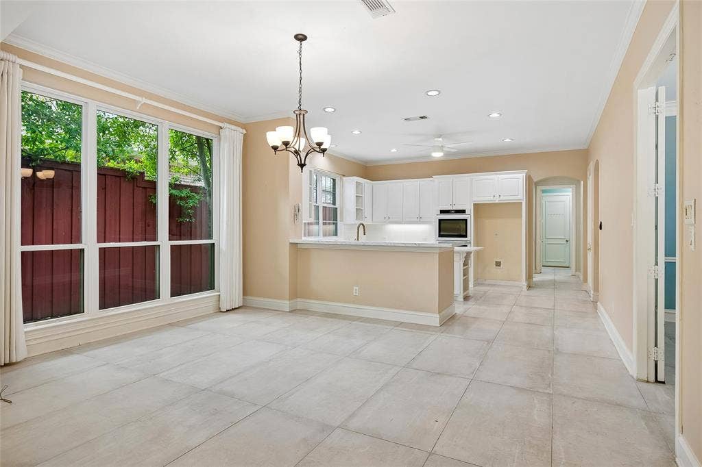 8141 Rosemont Drive, Plano, TX 75025 Spacious dining area with custom drapes accommodates huge tables and many guests