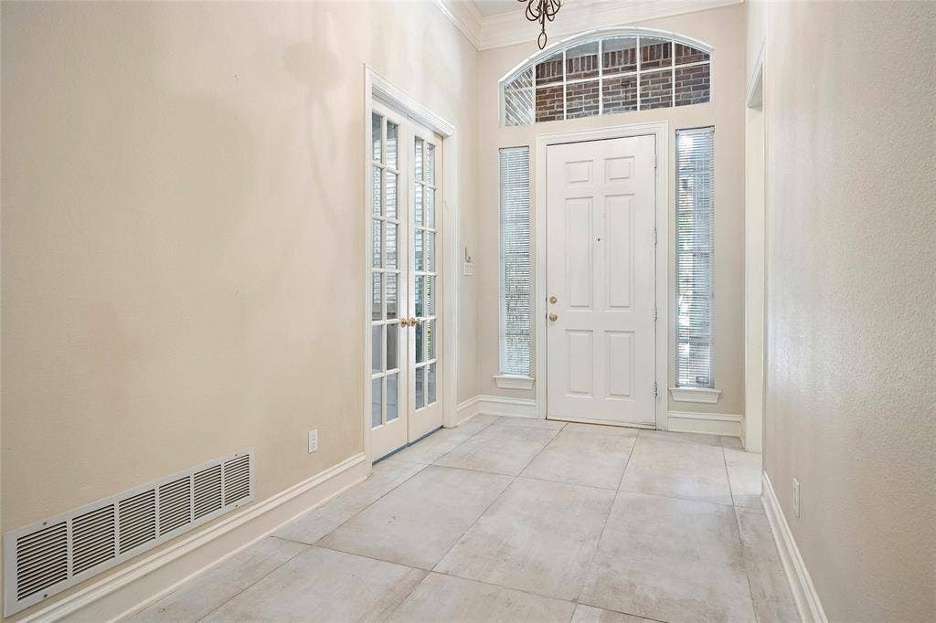 8141 Rosemont Drive, Plano, TX 75025 Custom tile, French doors to office or bedroom, double sidelights and eyebrow window over door.