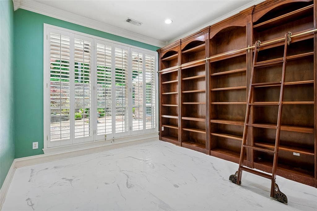 8141 Rosemont Drive, Plano, TX 75025 Wall of windows with shutters overlooks patio. Custom floor.