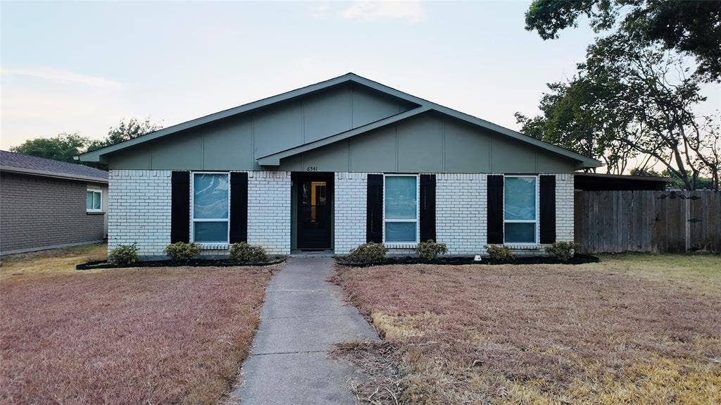 6541 Santa Fe Trail, Plano, TX 75023 Brick and siding exterior with a pitched roof