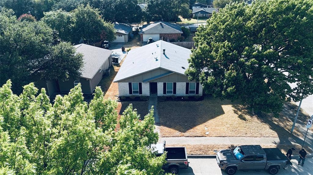 6541 Santa Fe Trail, Plano, TX 75023 Single-story residence featuring a gabled roof and traditional brick exterior