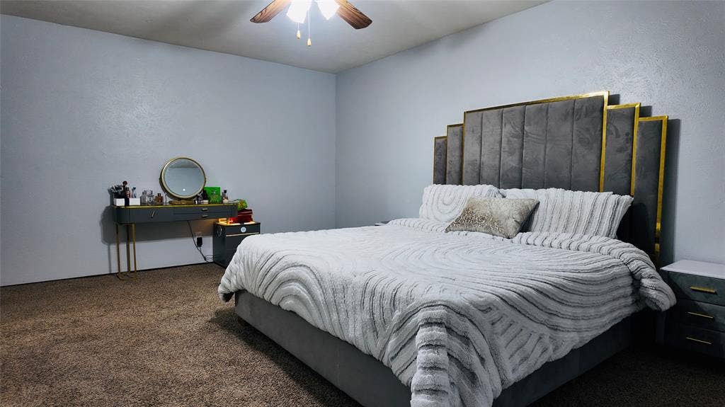 6541 Santa Fe Trail, Plano, TX 75023 Textured wall finishes with a ceiling-mounted fan and light fixture
