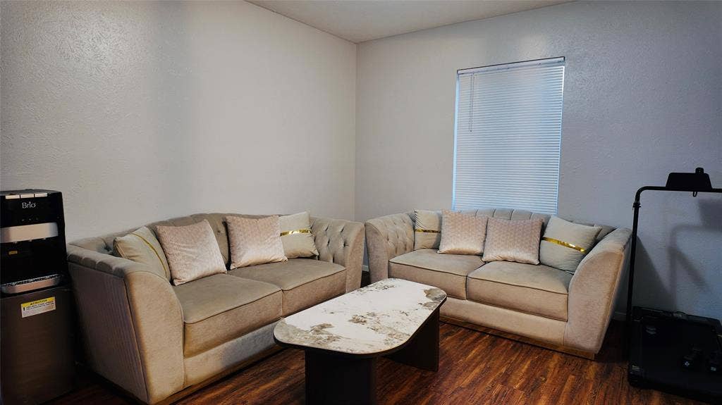 6541 Santa Fe Trail, Plano, TX 75023 Wood-finish flooring, white walls, and a window with horizontal blinds