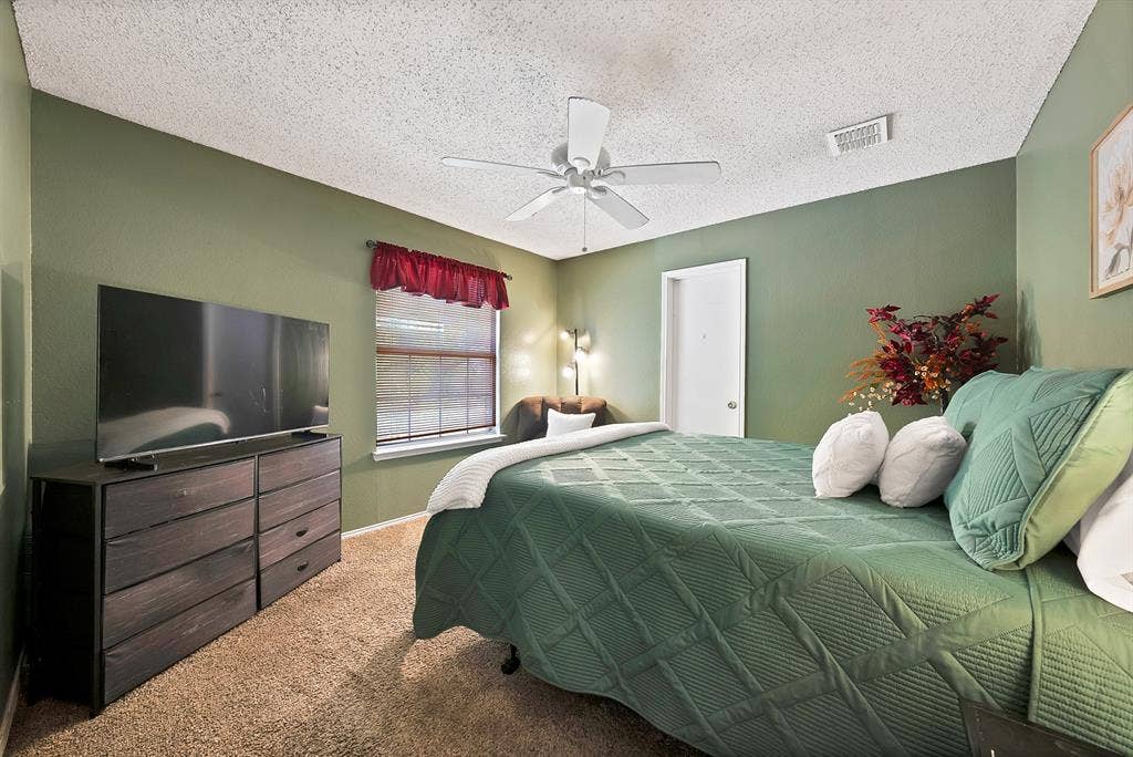 2326 Mcintosh Court, Lancaster, TX 75134 Carpeted room with a ceiling fan, window with blinds, and painted walls