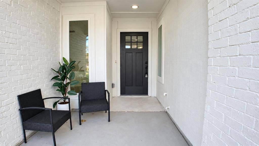 2417 Via Barcelona, Carrollton, TX 75006 Covered entry with painted brick exterior