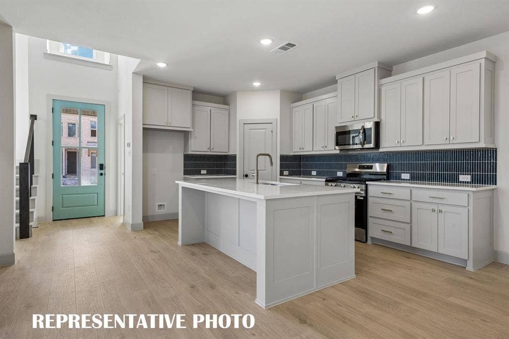 633 Taylor Parkway, Celina, TX 75009 With ample storage and prep space, all the chef's in the family will love this dream kitchen! REPRESENTATIVE PHOTO