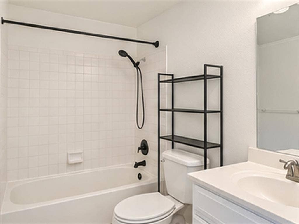 1919 American Drive, #B112, Lago Vista, TX 78645 Bathtub with white square tile surround and matte black fixtures