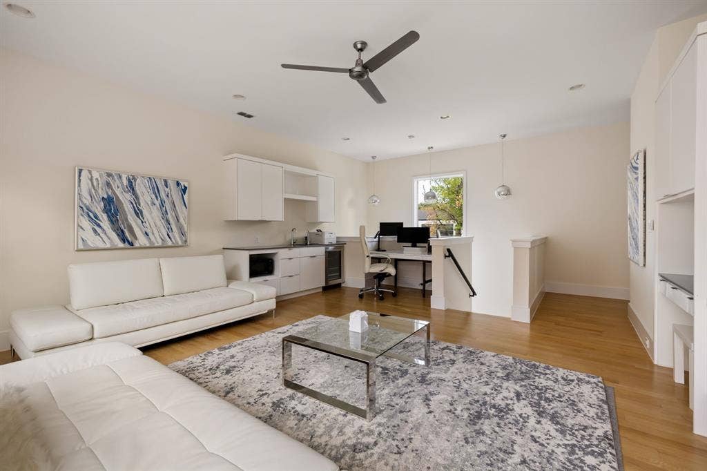 5724 Charlestown Drive, Dallas, TX 75230 Hardwood flooring, recessed lighting, ceiling fan, built-in cabinetry with integrated sink, and a built-in desk area