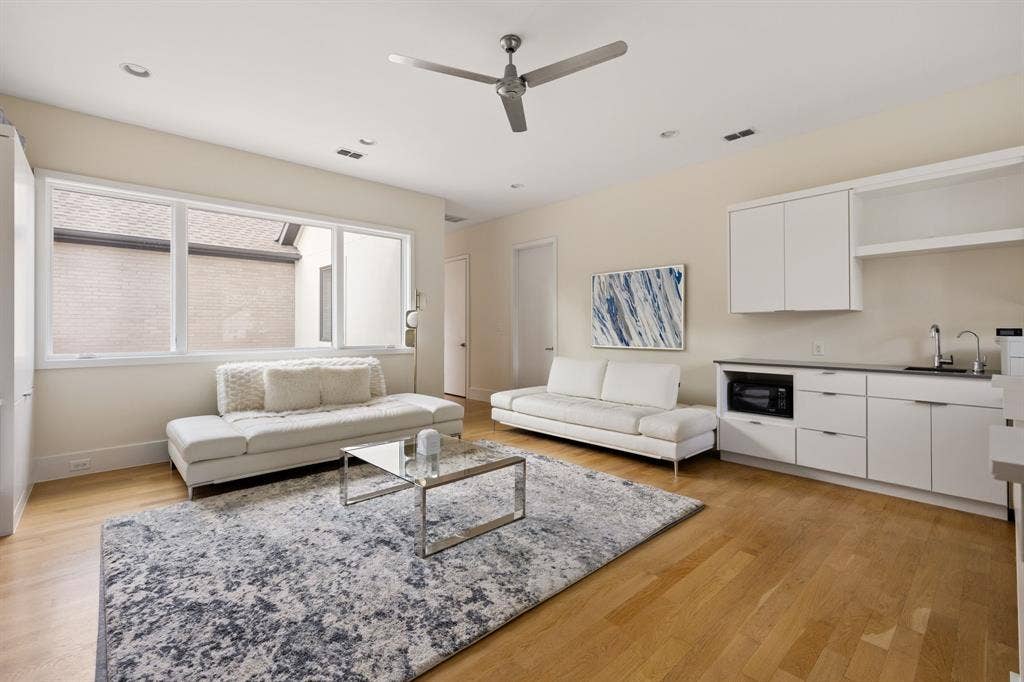 5724 Charlestown Drive, Dallas, TX 75230 Wood-finish flooring, recessed lighting, and a modern ceiling fan