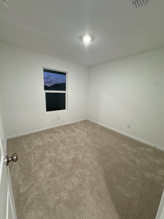 7908 Gilbert Street, McKinney, TX 75071 Recessed ceiling lighting, neutral tone carpeting, white painted walls, and a window with a dark frame