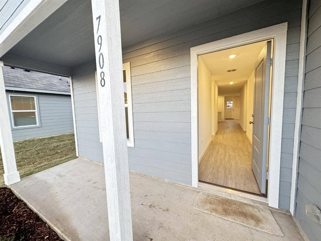 7908 Gilbert Street, McKinney, TX 75071 Siding exterior with a covered concrete porch
